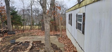 Calling all investors and weekend retreat seekers! If you love on Linn Valley Lakes - Deer Trace Golf Course in Kansas - for sale on GolfHomes.com, golf home, golf lot