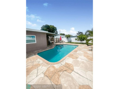 Discover this updated gem located in the heart of Pompano Beach on Pompano Beach Golf Course  in Florida - for sale on GolfHomes.com, golf home, golf lot