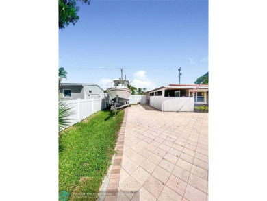 Discover this updated gem located in the heart of Pompano Beach on Pompano Beach Golf Course  in Florida - for sale on GolfHomes.com, golf home, golf lot