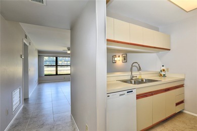 Amazing golf & lake views set the tone for this well-located on Vista Plantation Golf Club in Florida - for sale on GolfHomes.com, golf home, golf lot