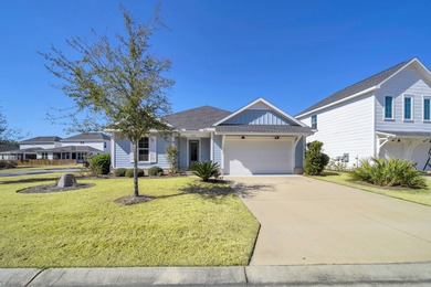 As you arrive at 304 Windrow Way, the corner-lot setting and on Origins Golf Club in Florida - for sale on GolfHomes.com, golf home, golf lot