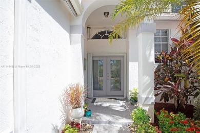 Elegant two-story home located in the prestigious Weston Hills on Weston Hills Country Club in Florida - for sale on GolfHomes.com, golf home, golf lot