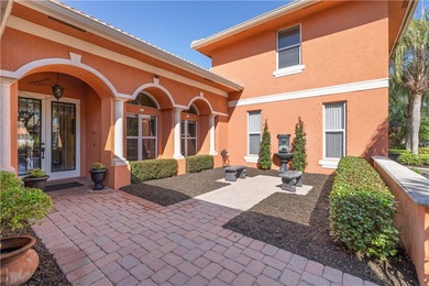 Meticulously landscaped courtyard entry, sculpted gardens and on Bent Pine Golf Club in Florida - for sale on GolfHomes.com, golf home, golf lot