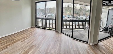 Come home and relax overlooking the water and boats in the cove on Club At Rawls Creek in South Carolina - for sale on GolfHomes.com, golf home, golf lot