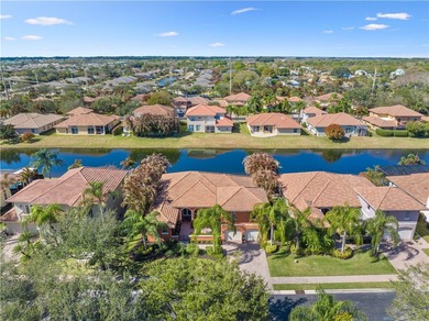 Meticulously landscaped courtyard entry, sculpted gardens and on Bent Pine Golf Club in Florida - for sale on GolfHomes.com, golf home, golf lot
