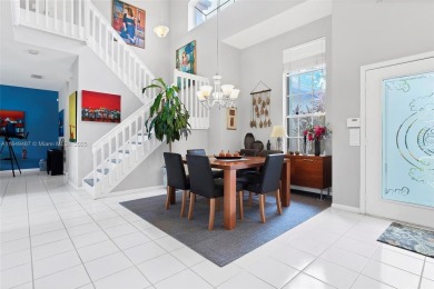 Elegant two-story home located in the prestigious Weston Hills on Weston Hills Country Club in Florida - for sale on GolfHomes.com, golf home, golf lot