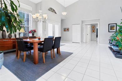 Elegant two-story home located in the prestigious Weston Hills on Weston Hills Country Club in Florida - for sale on GolfHomes.com, golf home, golf lot