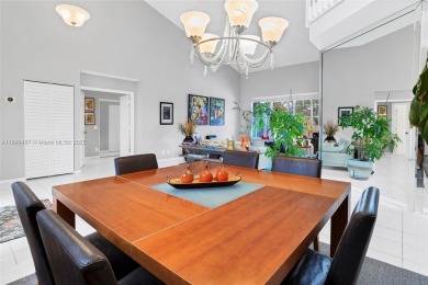 Elegant two-story home located in the prestigious Weston Hills on Weston Hills Country Club in Florida - for sale on GolfHomes.com, golf home, golf lot