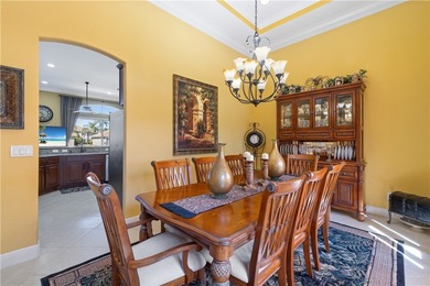 Meticulously landscaped courtyard entry, sculpted gardens and on Bent Pine Golf Club in Florida - for sale on GolfHomes.com, golf home, golf lot