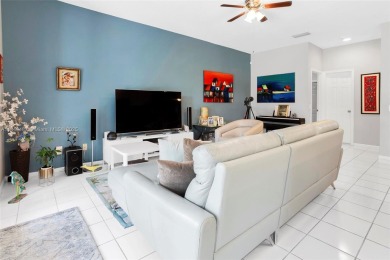 Elegant two-story home located in the prestigious Weston Hills on Weston Hills Country Club in Florida - for sale on GolfHomes.com, golf home, golf lot