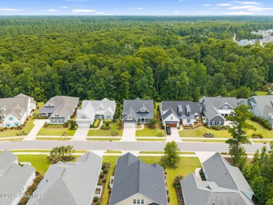 Experience vibrant community living at 6441 Saxon Meadow Drive on Cape Fear National At Brunswick Forest in North Carolina - for sale on GolfHomes.com, golf home, golf lot