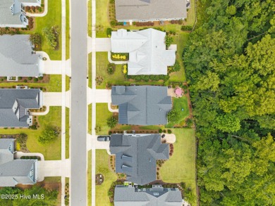 Experience vibrant community living at 6441 Saxon Meadow Drive on Cape Fear National At Brunswick Forest in North Carolina - for sale on GolfHomes.com, golf home, golf lot