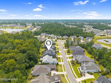 Experience vibrant community living at 6441 Saxon Meadow Drive on Cape Fear National At Brunswick Forest in North Carolina - for sale on GolfHomes.com, golf home, golf lot