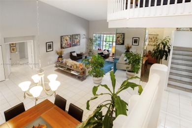 Elegant two-story home located in the prestigious Weston Hills on Weston Hills Country Club in Florida - for sale on GolfHomes.com, golf home, golf lot