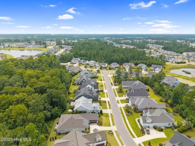 Experience vibrant community living at 6441 Saxon Meadow Drive on Cape Fear National At Brunswick Forest in North Carolina - for sale on GolfHomes.com, golf home, golf lot