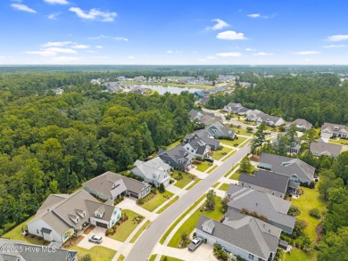 Experience vibrant community living at 6441 Saxon Meadow Drive on Cape Fear National At Brunswick Forest in North Carolina - for sale on GolfHomes.com, golf home, golf lot
