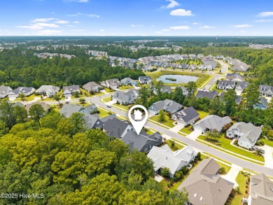 Experience vibrant community living at 6441 Saxon Meadow Drive on Cape Fear National At Brunswick Forest in North Carolina - for sale on GolfHomes.com, golf home, golf lot