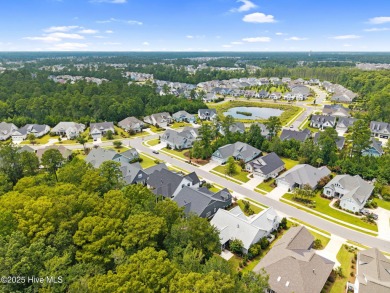 Experience vibrant community living at 6441 Saxon Meadow Drive on Cape Fear National At Brunswick Forest in North Carolina - for sale on GolfHomes.com, golf home, golf lot