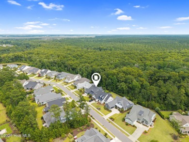 Experience vibrant community living at 6441 Saxon Meadow Drive on Cape Fear National At Brunswick Forest in North Carolina - for sale on GolfHomes.com, golf home, golf lot