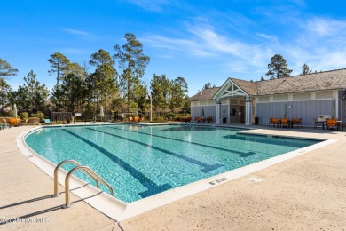 Experience vibrant community living at 6441 Saxon Meadow Drive on Cape Fear National At Brunswick Forest in North Carolina - for sale on GolfHomes.com, golf home, golf lot