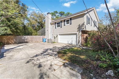 Located in the sought-after Country Club Estates, this 4-bedroom on DeLand Country Club in Florida - for sale on GolfHomes.com, golf home, golf lot