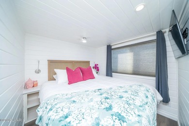 Set along the scenic Colorado River, this bungalow at Roadrunner on Emerald Canyon Golf Course in Arizona - for sale on GolfHomes.com, golf home, golf lot