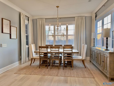 Step into this professionally decorated 3-bedroom, 2-bath home on Gunters Landing in Alabama - for sale on GolfHomes.com, golf home, golf lot