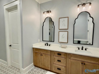 Step into this professionally decorated 3-bedroom, 2-bath home on Gunters Landing in Alabama - for sale on GolfHomes.com, golf home, golf lot