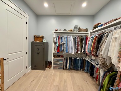 Step into this professionally decorated 3-bedroom, 2-bath home on Gunters Landing in Alabama - for sale on GolfHomes.com, golf home, golf lot