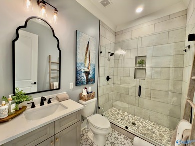 Step into this professionally decorated 3-bedroom, 2-bath home on Gunters Landing in Alabama - for sale on GolfHomes.com, golf home, golf lot