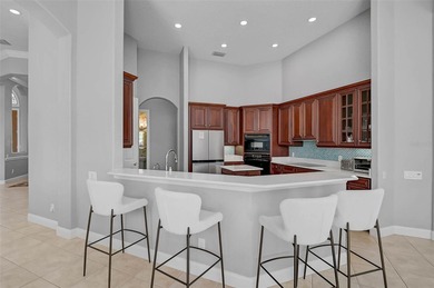 **ELEGANT UPDATED RESIDENCE IN THE OAKS | MODERN COMFORT ON A on The Oaks Club in Florida - for sale on GolfHomes.com, golf home, golf lot