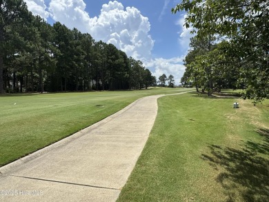 Welcome to easy living in this beautifully maintained 2-bedroom on Wilson Country Club in North Carolina - for sale on GolfHomes.com, golf home, golf lot