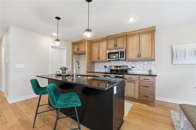 Come home to this attractive 4-bedroom, 3.5-bath two-story on Golf Club of Creekmoor in Missouri - for sale on GolfHomes.com, golf home, golf lot