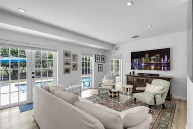 Light-filled and move-in ready, this walled and gated corner-lot on La Gorce Country Club in Florida - for sale on GolfHomes.com, golf home, golf lot