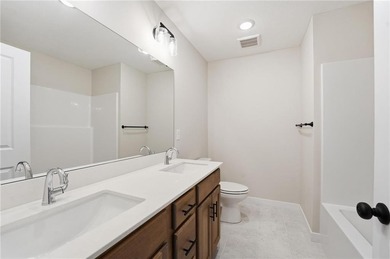 Come home to this attractive 4-bedroom, 3.5-bath two-story on Golf Club of Creekmoor in Missouri - for sale on GolfHomes.com, golf home, golf lot