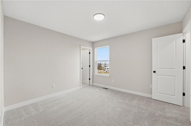 Come home to this attractive 4-bedroom, 3.5-bath two-story on Golf Club of Creekmoor in Missouri - for sale on GolfHomes.com, golf home, golf lot