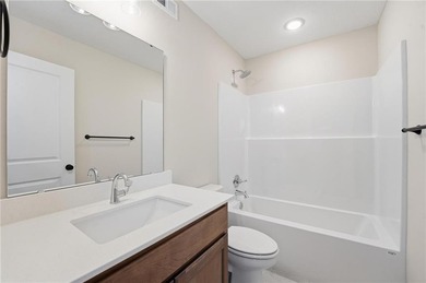 Come home to this attractive 4-bedroom, 3.5-bath two-story on Golf Club of Creekmoor in Missouri - for sale on GolfHomes.com, golf home, golf lot