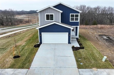 Come home to this attractive 4-bedroom, 3.5-bath two-story on Golf Club of Creekmoor in Missouri - for sale on GolfHomes.com, golf home, golf lot