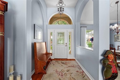 Discover a remarkable 4-bedroom, 3-bathroom pool home in the on Hunters Green Country Club in Florida - for sale on GolfHomes.com, golf home, golf lot