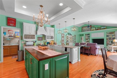 Discover a remarkable 4-bedroom, 3-bathroom pool home in the on Hunters Green Country Club in Florida - for sale on GolfHomes.com, golf home, golf lot