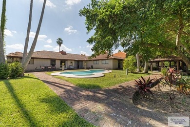 Beautiful 4-bedroom, 5-bath home on a resaca lot in Rancho on Rancho Viejo Resort and Country Club in Texas - for sale on GolfHomes.com, golf home, golf lot