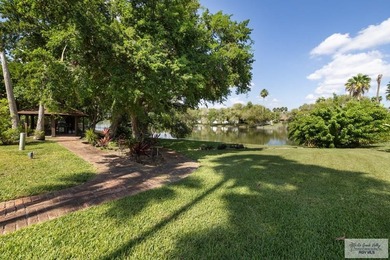 Beautiful 4-bedroom, 5-bath home on a resaca lot in Rancho on Rancho Viejo Resort and Country Club in Texas - for sale on GolfHomes.com, golf home, golf lot