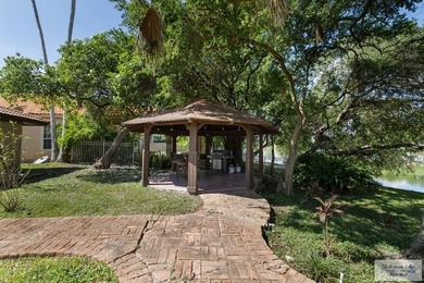 Beautiful 4-bedroom, 5-bath home on a resaca lot in Rancho on Rancho Viejo Resort and Country Club in Texas - for sale on GolfHomes.com, golf home, golf lot