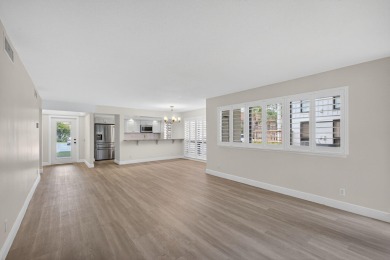 Enjoy effortless living in this beautifully remodeled 2-bedroom on PGA National Golf Club in Florida - for sale on GolfHomes.com, golf home, golf lot