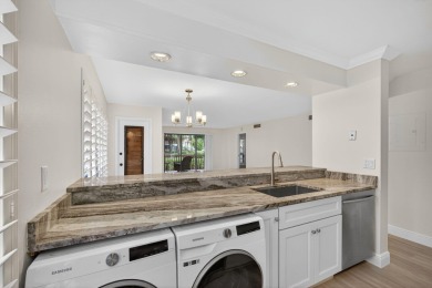 Enjoy effortless living in this beautifully remodeled 2-bedroom on PGA National Golf Club in Florida - for sale on GolfHomes.com, golf home, golf lot