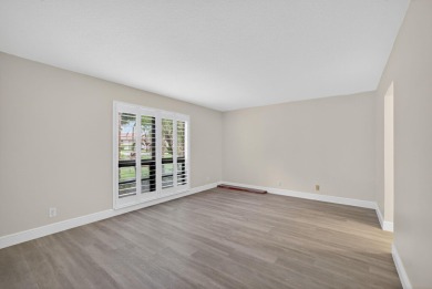Enjoy effortless living in this beautifully remodeled 2-bedroom on PGA National Golf Club in Florida - for sale on GolfHomes.com, golf home, golf lot