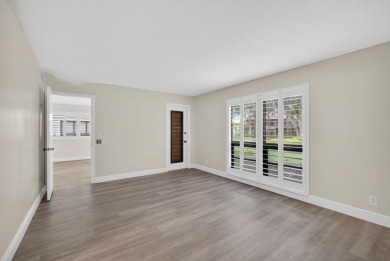 Enjoy effortless living in this beautifully remodeled 2-bedroom on PGA National Golf Club in Florida - for sale on GolfHomes.com, golf home, golf lot