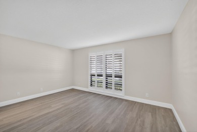 Enjoy effortless living in this beautifully remodeled 2-bedroom on PGA National Golf Club in Florida - for sale on GolfHomes.com, golf home, golf lot