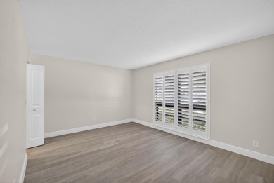 Enjoy effortless living in this beautifully remodeled 2-bedroom on PGA National Golf Club in Florida - for sale on GolfHomes.com, golf home, golf lot