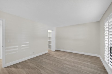 Enjoy effortless living in this beautifully remodeled 2-bedroom on PGA National Golf Club in Florida - for sale on GolfHomes.com, golf home, golf lot